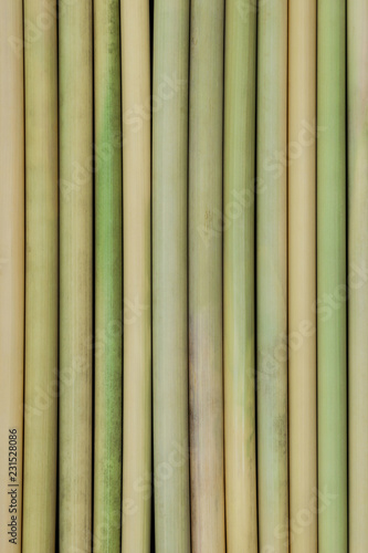 Background surface of bamboo sticks placed next to each other