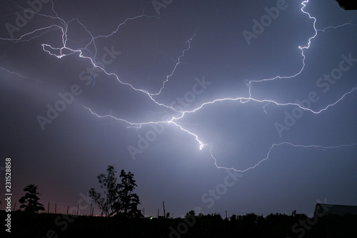 A lightningbolt creeps through the sky over Transylvania, Romania