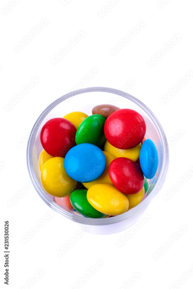 Multicoloured sweets in a little glass. Isolated object Multicoloured sweets in a little glass. Isolated object