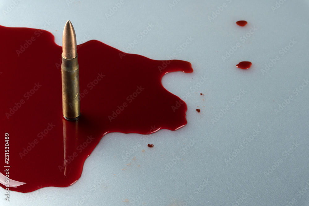 crime scene concept, close up of a gun bullet in pool of blood Stock 写真 ...