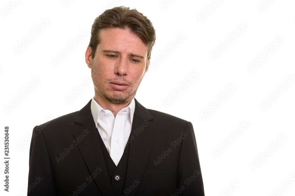 Handsome Caucasian businessman looking exhausted and tired Handsome Caucasian businessman looking exhausted and tired