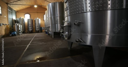 Wine production industry, detail of metal tanks. Quick hand held stabilized traveling and rotating movement making detail of metal tank. Mendoza, Argentina. 