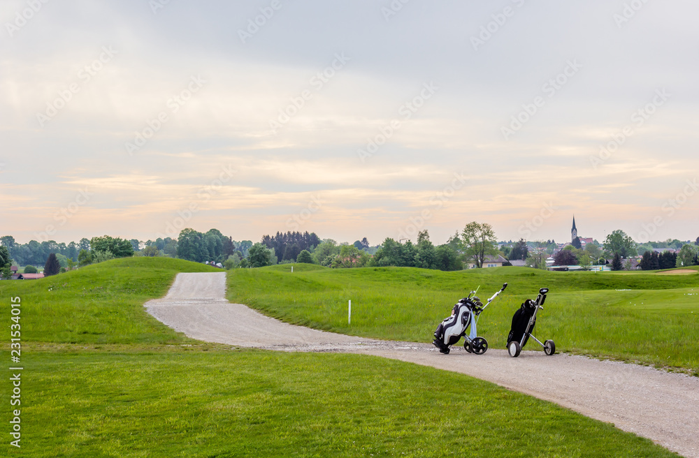 Golfcourse in Germany with two golfbags