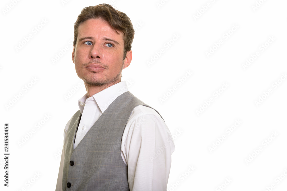 Handsome formal Caucasian man wearing vest while thinking Handsome formal Caucasian man wearing vest while thinking