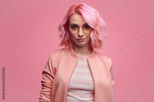 Confident trendy woman in pink outfit