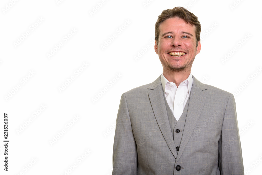 Happy Caucasian businessman looking at camera while smiling Happy Caucasian businessman looking at camera while smiling
