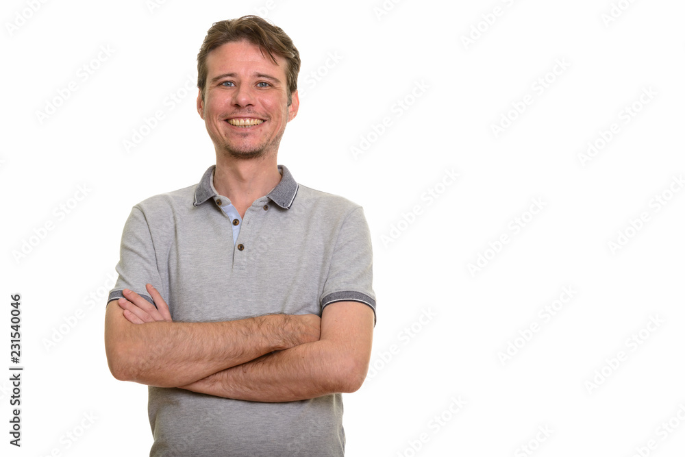 Happy Caucasian man looking confident with arms crossed Happy Caucasian man looking confident with arms crossed