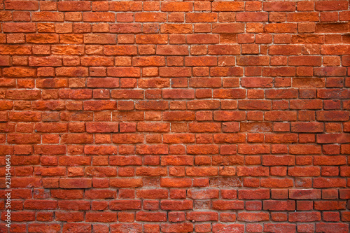 red brick wall background. Weathered rough red surface. 