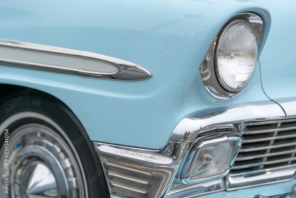 Close up of vintage blue car bumber and lamps