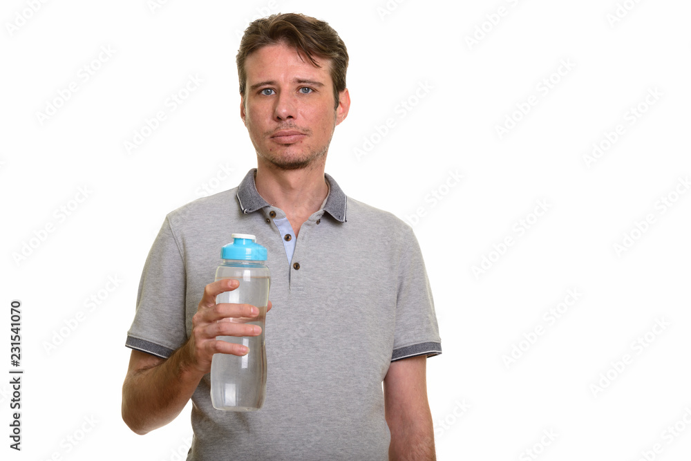 Portrait of handsome Caucasian man holding water bottle Portrait of handsome Caucasian man holding water bottle