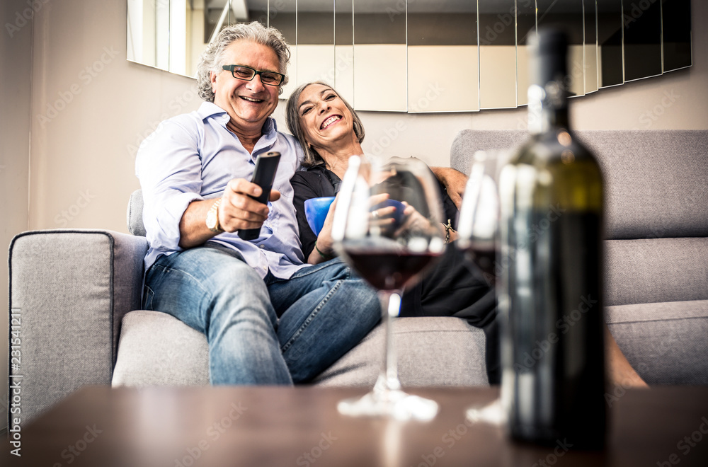 Senior couple spending time in the living room Senior couple spending time in the living room