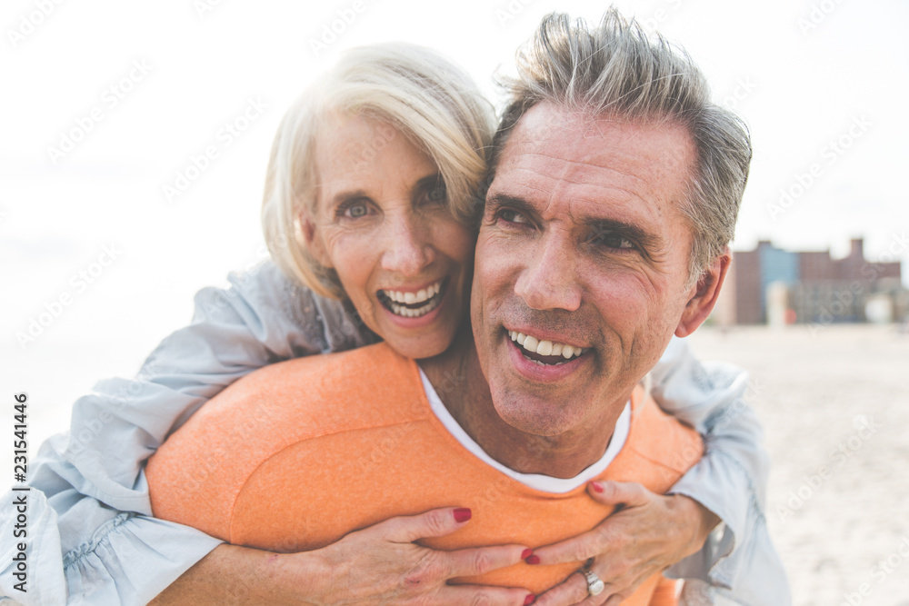 Happy senior couple spending time at the beach. Concepts about love,seniority and people Happy senior couple spending time at the beach. Concepts about love,seniority and people