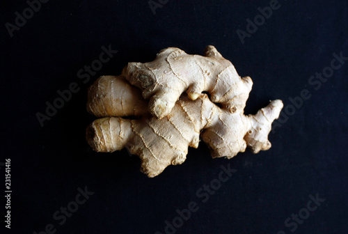 Two pieces of ginger isolated on black background