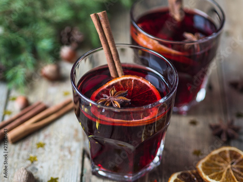Traditional winter alcoholic drink - mulled wine. Hot wine with fruits and spices in glasses