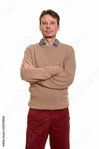 Handsome Caucasian man with arms crossed looking at camera