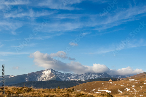 Nature landscape rodnei mountains with clouds over the peaks photo