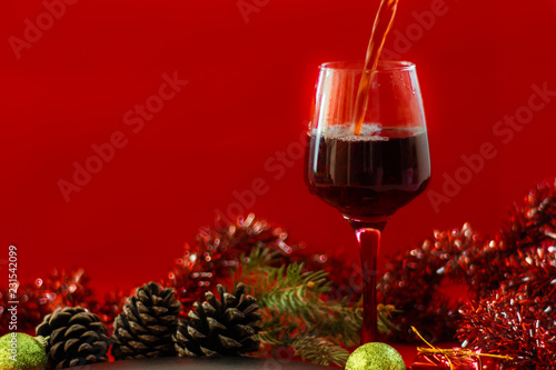 Christams Holiday Red Wine on Wood Table and Christmas Tree