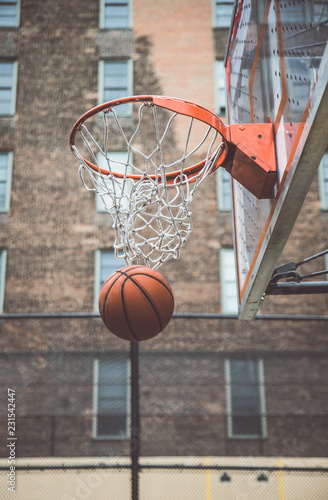 Fotografie Basketball player training on a court in New york city