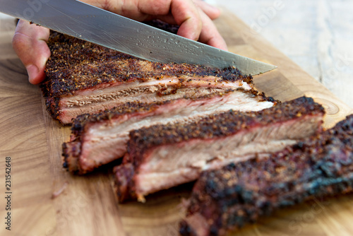 Cutting pork ribs on cutting board