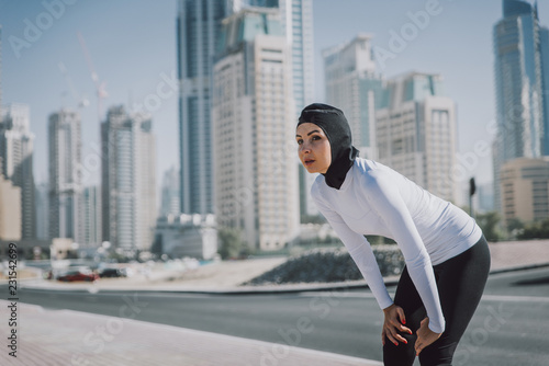 Photography Arabic woman runner, making some urban running