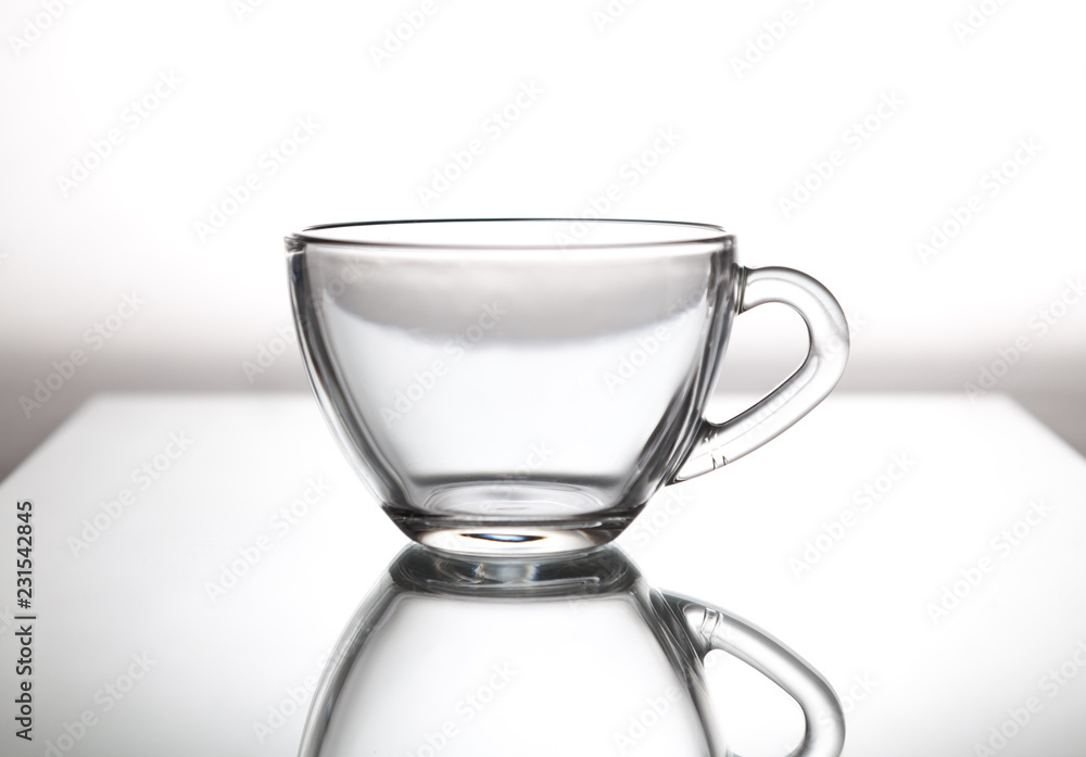 Glass cup for tea is on glass