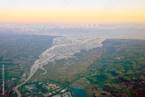 Aerial shot of the Dee estuary and the Wirral, England, UK, evening light.