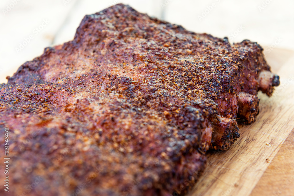 St Louis style grilled pork ribs on cutting board St Louis style grilled pork ribs on cutting board