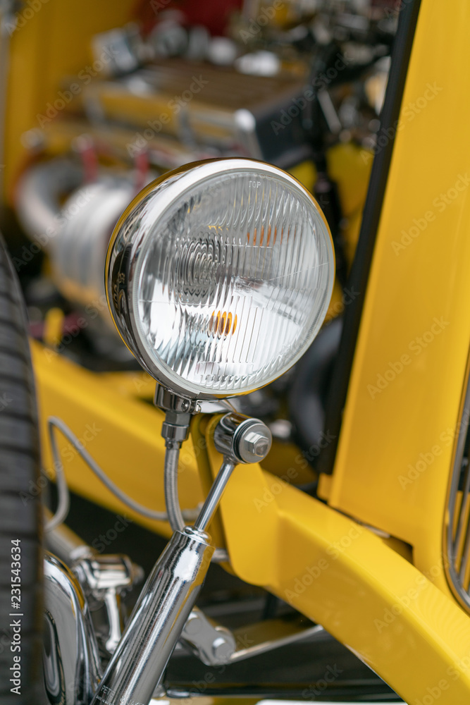 Close up of vintage yellow car bumber and lamps