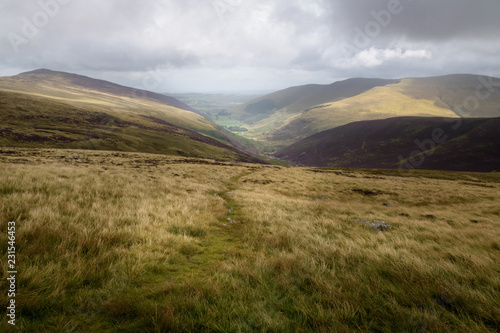 View into the valley from high pike with rough weather England