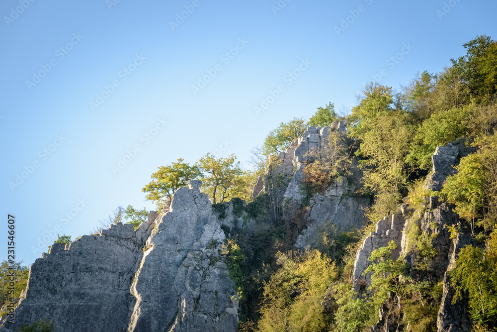 beautiful rock formation light up at golden hour and blue sky Ardennes