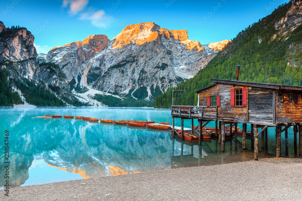 Spectacular wooden boathouse on the alpine lake, Dolomites, Italy, Europe - obrazy, fototapety, plakaty 