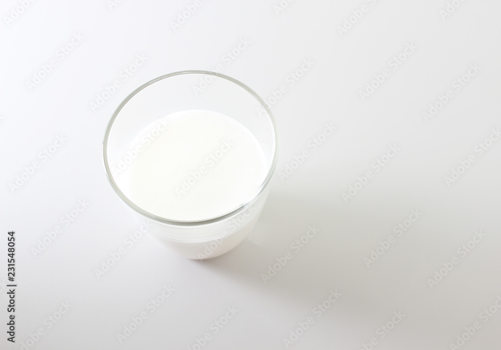 milk foam glass on a light background milk foam glass on a light background
