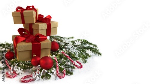 Christmas decoration with presents, lollipops and stars on white background.
