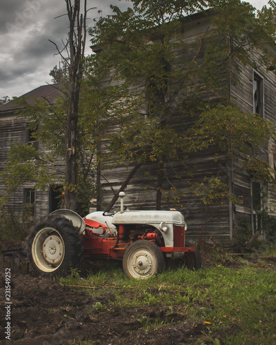 Wallpaper Mural old tractor in front of abandoned house Torontodigital.ca