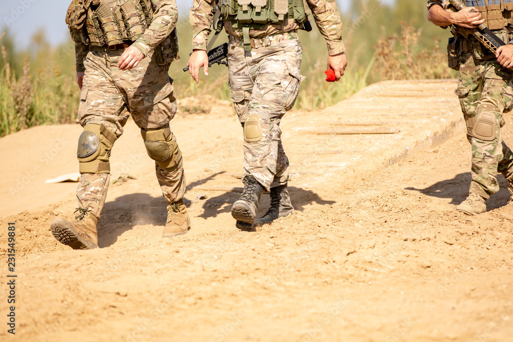 group of soldiers on the Outdoor on army exercises. war, army, technology and people concept group of soldiers on the Outdoor on army exercises. war, army, technology and people concept