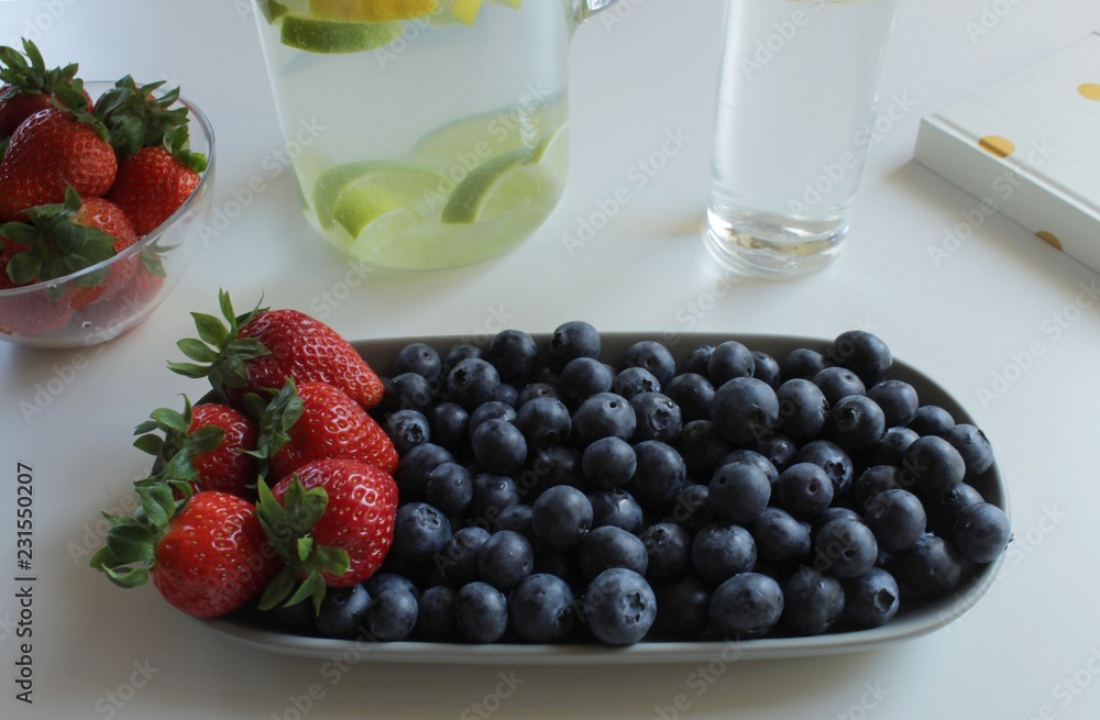 Tray with healthy snack consisting of blueberries and strawberries Tray with healthy snack consisting of blueberries and strawberries