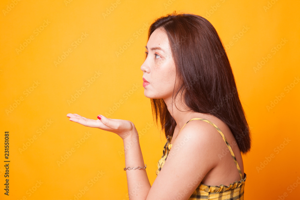 Beautiful young Asian woman blow a kiss. Beautiful young Asian woman blow a kiss.