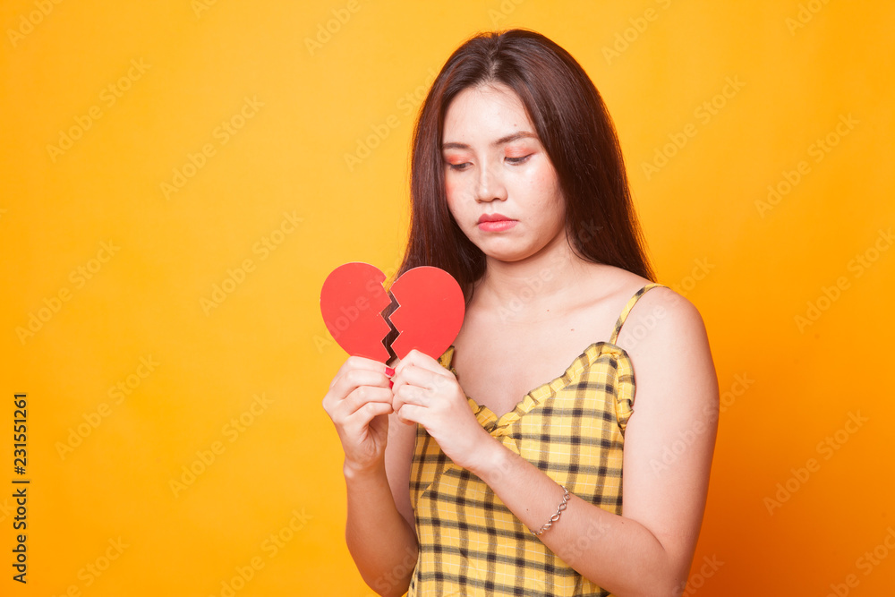 Beautiful young Asian woman with broken heart. Beautiful young Asian woman with broken heart.