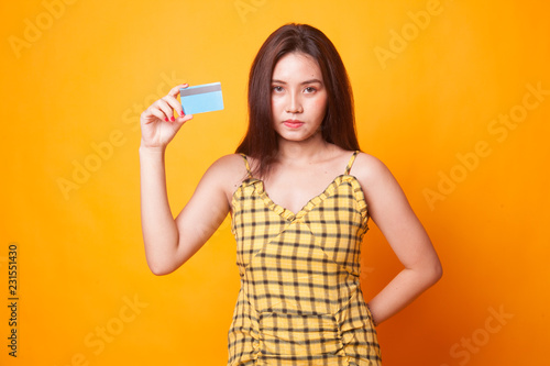 Young Asian woman with a blank card.
