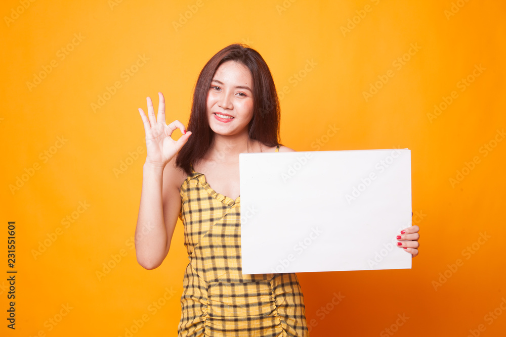 Young Asian woman show OK with white blank sign. Young Asian woman show OK with white blank sign.