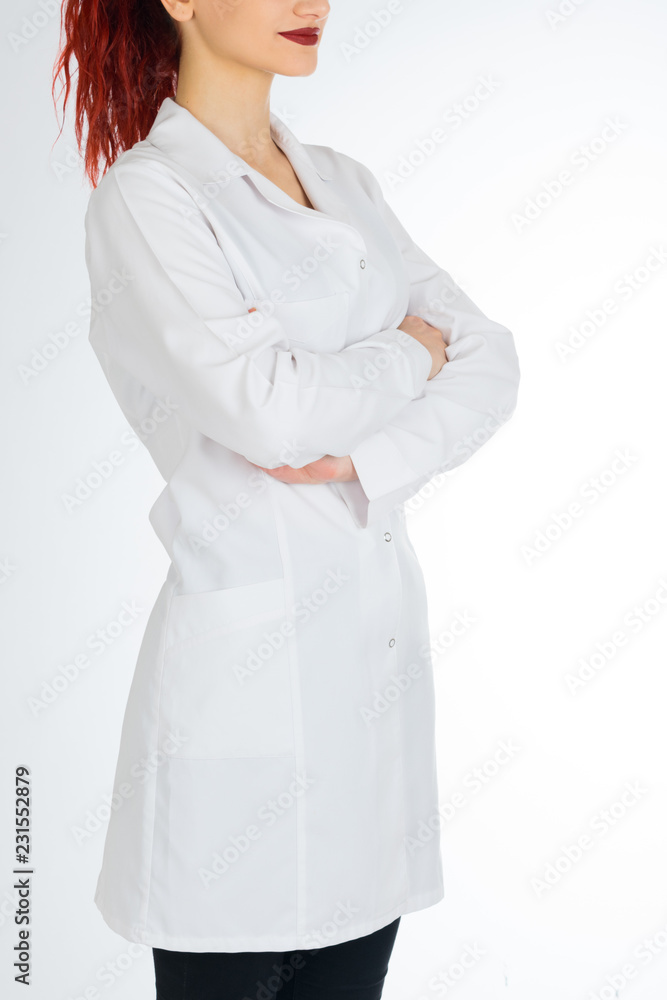 Female doctor with red hair. Isolated white background. stethoscope file and white uniform Female doctor with red hair. Isolated white background. stethoscope file and white uniform