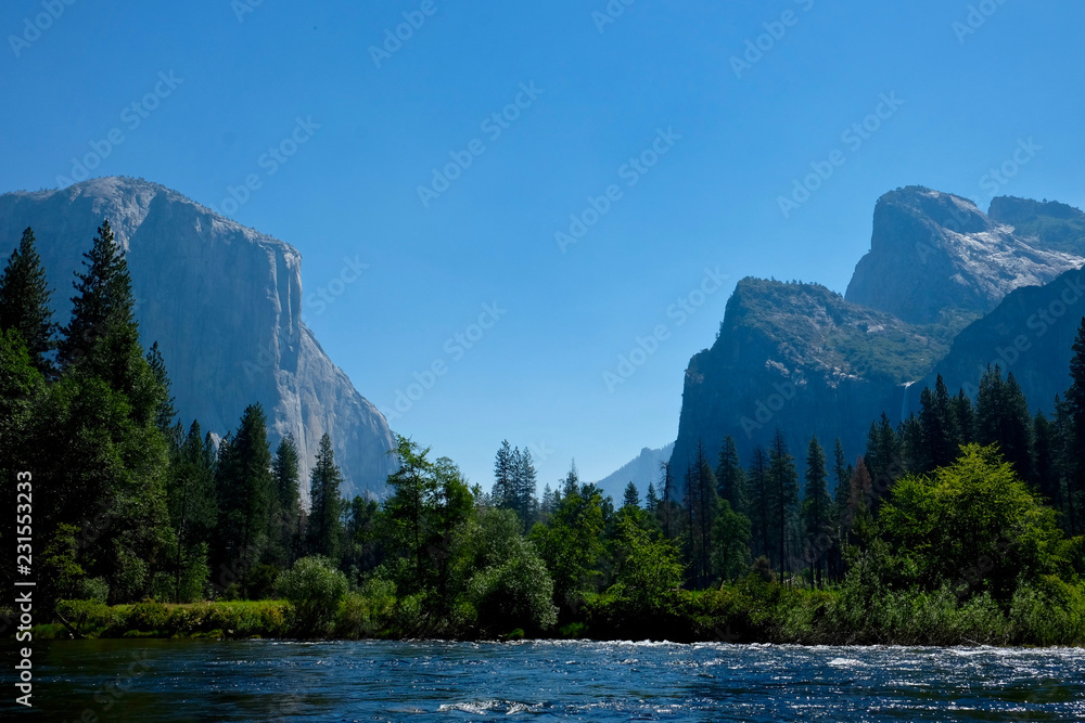 The view down Yosemite Valley from a river.