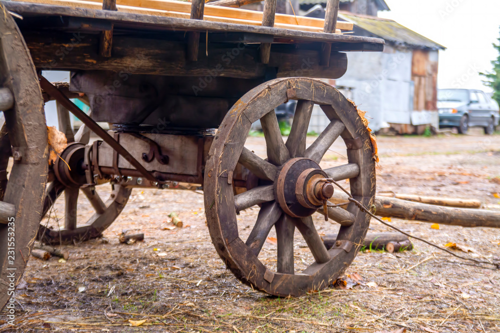 An old wooden cart stands in the village.
