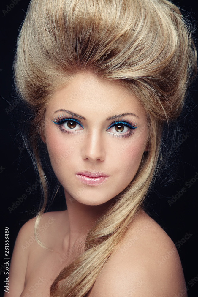 Close-up portrait of beautiful woman with fancy cat eye make-up Close-up portrait of beautiful woman with fancy cat eye make-up