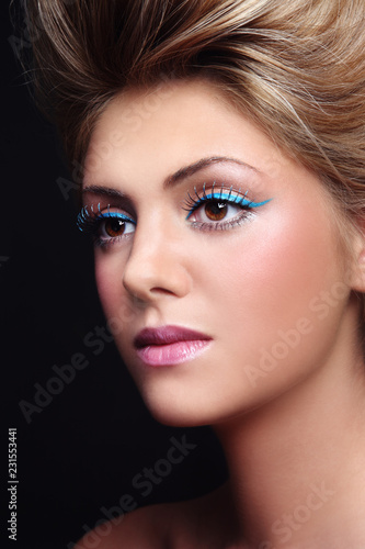 Close-up portrait of beautiful woman with fancy cat eye make-up
