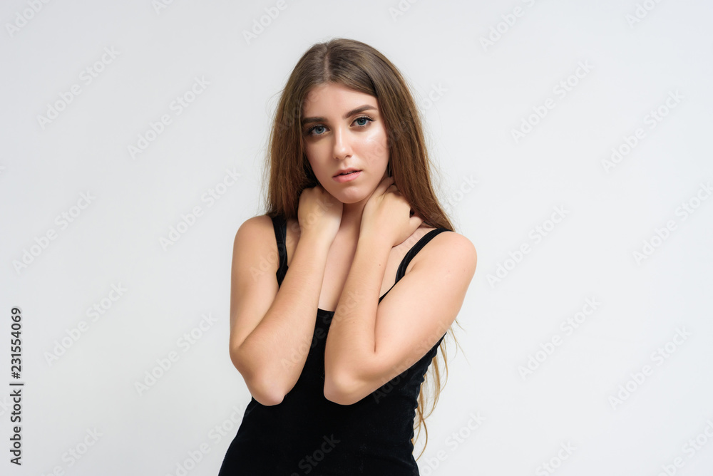 Studio portrait of a smiling happy beautiful brunette girl on white background. Studio portrait of a smiling happy beautiful brunette girl on white background.