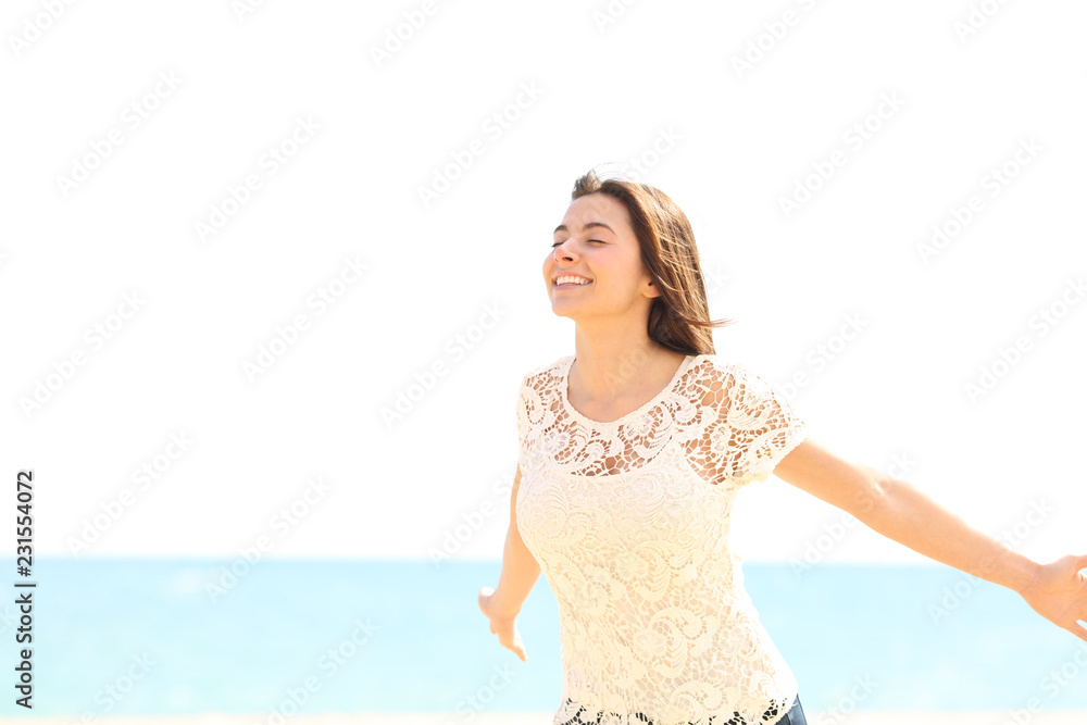 Happy woman breathing fresh air enjoying wind Happy woman breathing fresh air enjoying wind