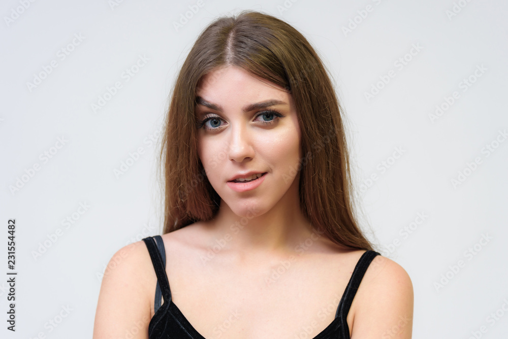 Studio portrait of a smiling happy beautiful brunette girl on white background. Studio portrait of a smiling happy beautiful brunette girl on white background.
