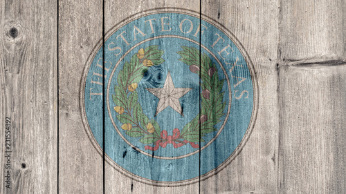 USA Politics News Concept: US State Texas Seal Wooden Fence Background