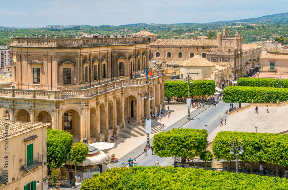 Panoramic view in Noto, with the Palazzo Ducezio and the Church of San Carlo. Province of Siracusa, Sicily, Italy.